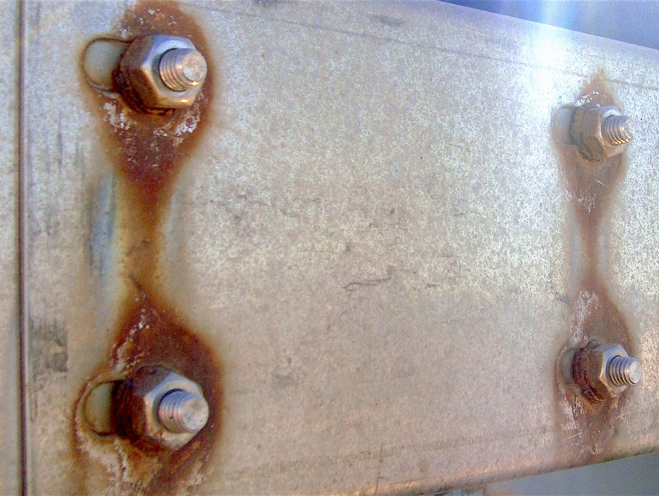 Galvanic corrosion due to differing anodic index between the bolts and the plate Galvanic corrosion due to differing anodic index between the bolts and the plate